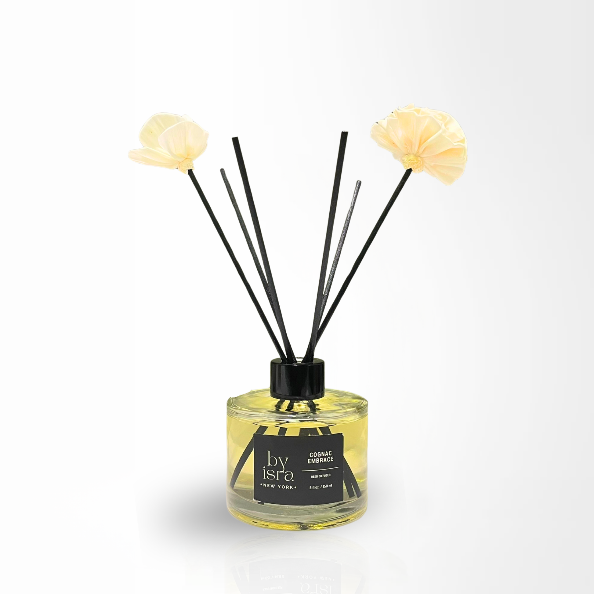 Diffuser with floral ends and black sticks on a white background